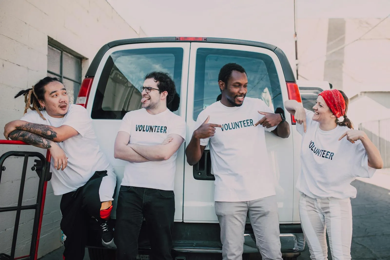 A cheerful, diverse group of volunteers in Volunteer t-shirts